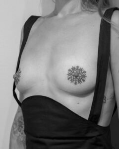Handpoke mandala tattoos on nipples by Dot by Dot in Berlin
